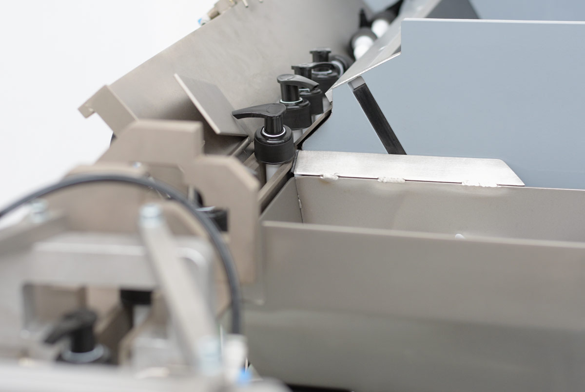 Escalator. Sistema industrial mecanico por elevacion de lamas para el posicionamiento automatizado de dosificadores vista detalle