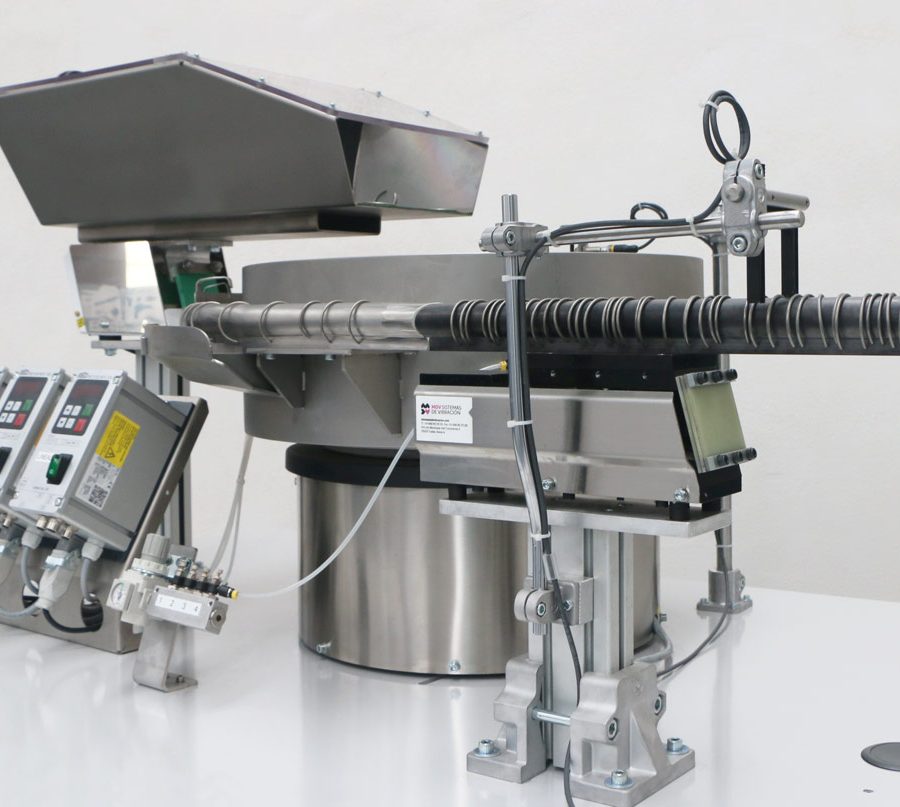 Vibrador para posicionamiento de piezas con tolva de acero