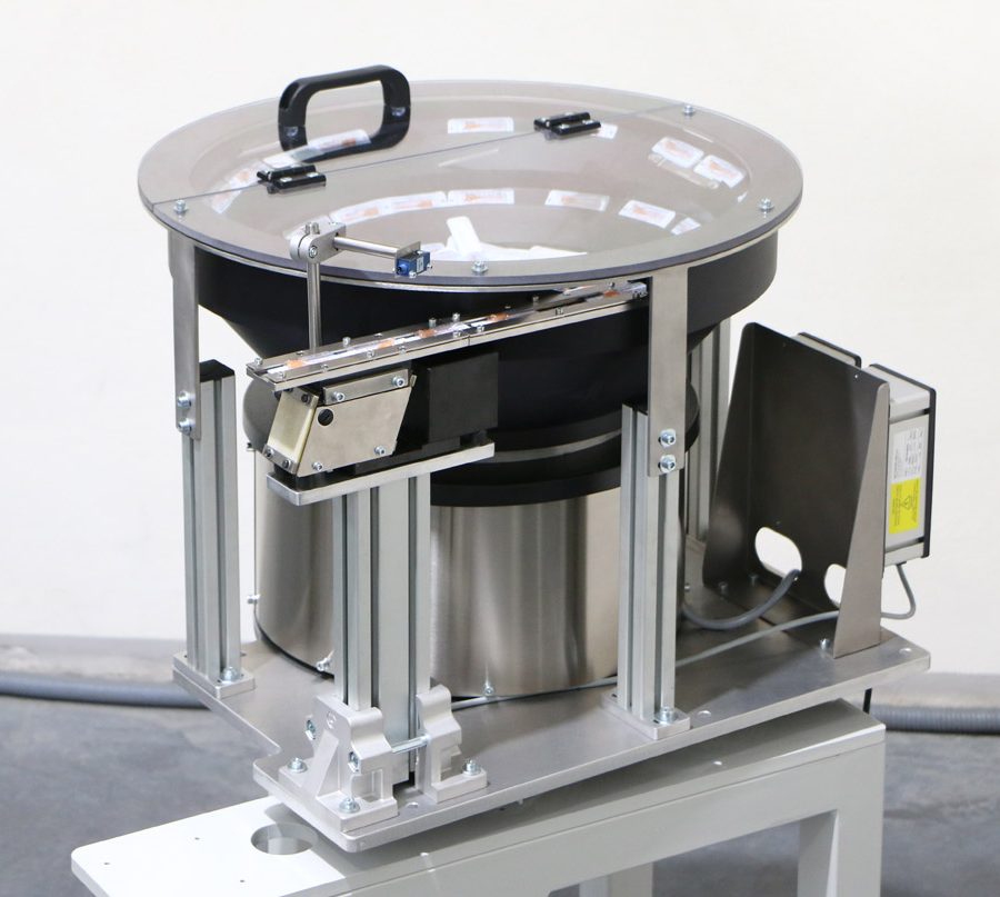 Vibrador posicionador con tolva de fibra