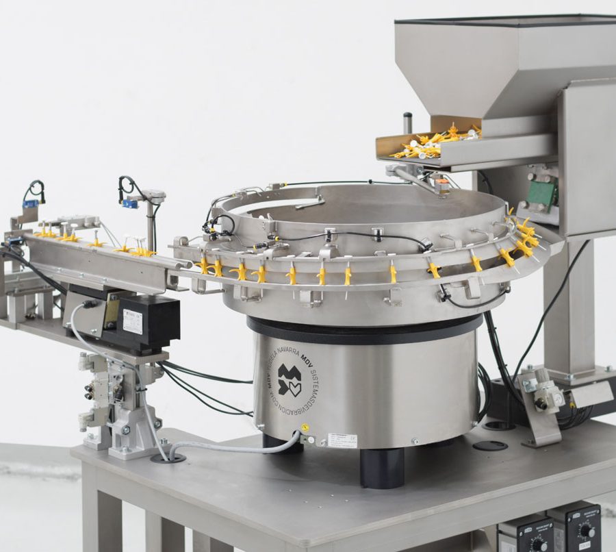 Posicionador vibrador circular con tolva de acero para dispensadores de chip