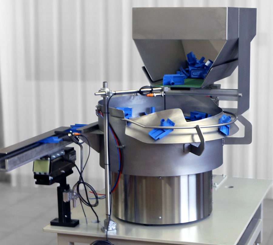 Vibrador para posicionamiento con tolva de acero