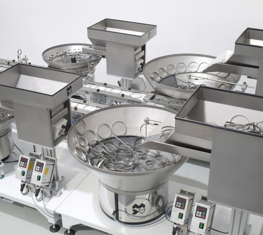 Conjunto dispensador vibratorio simétrico